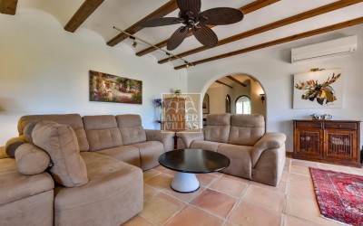 A beautiful villa in a peaceful, green setting.