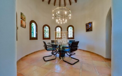 A beautiful villa in a peaceful, green setting.