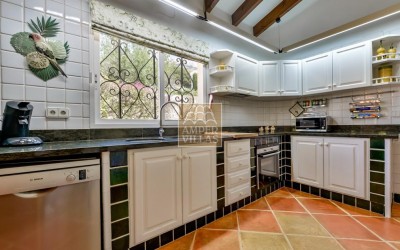 A beautiful villa in a peaceful, green setting.