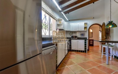 A beautiful villa in a peaceful, green setting.