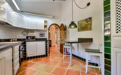 A beautiful villa in a peaceful, green setting.