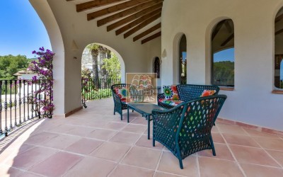 A beautiful villa in a peaceful, green setting.