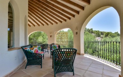 A beautiful villa in a peaceful, green setting.