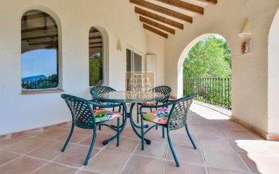 A beautiful villa in a peaceful, green setting.