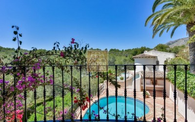 A beautiful villa in a peaceful, green setting.