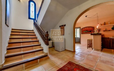 A beautiful villa in a peaceful, green setting.