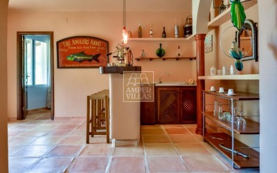 A beautiful villa in a peaceful, green setting.