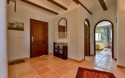 A beautiful villa in a peaceful, green setting.