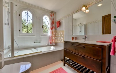 A beautiful villa in a peaceful, green setting.