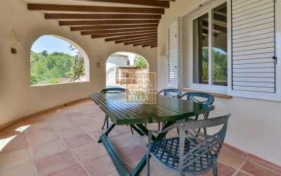 A beautiful villa in a peaceful, green setting.