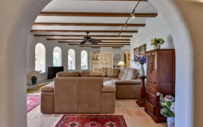 A beautiful villa in a peaceful, green setting.