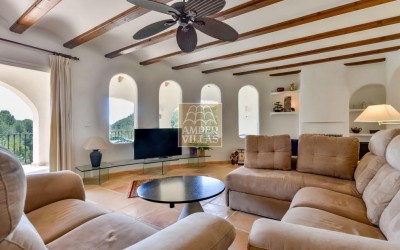 A beautiful villa in a peaceful, green setting.