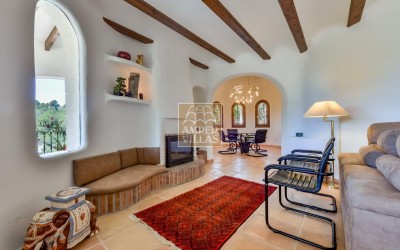 A beautiful villa in a peaceful, green setting.